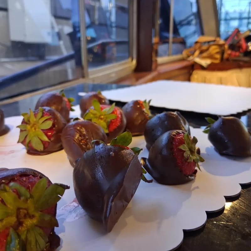 Chocolate-covered strawberries on a dessert platter aboard the yacht