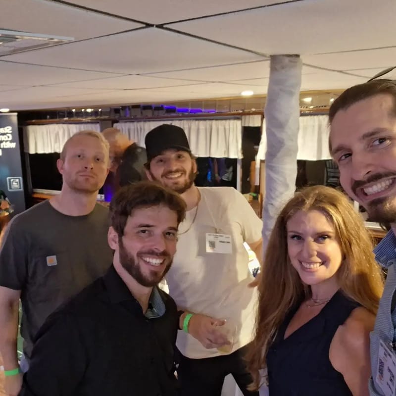 Chris Gittings taking a selfie with four guests inside the yacht