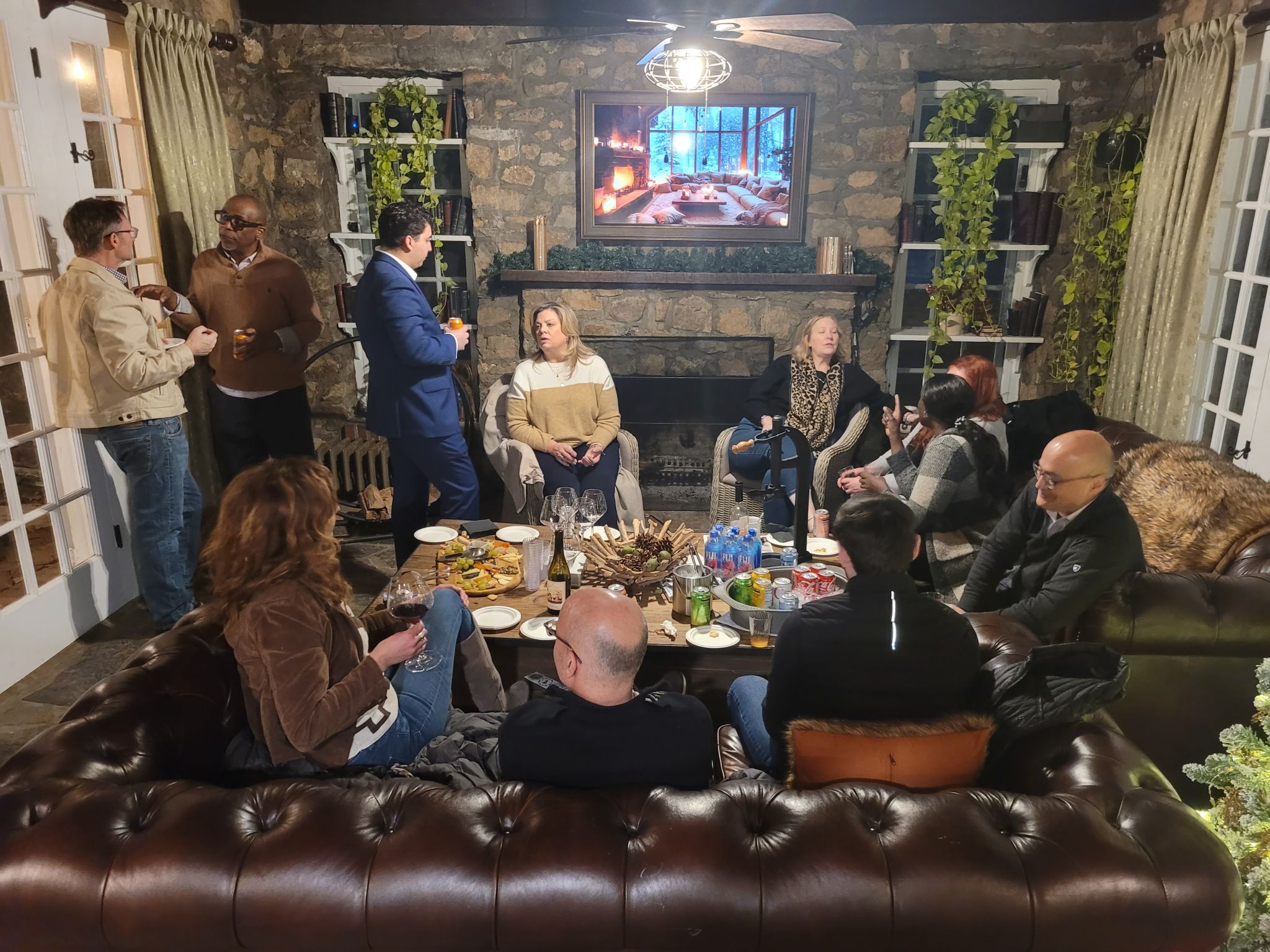 Attendees networking in a cozy living room setting